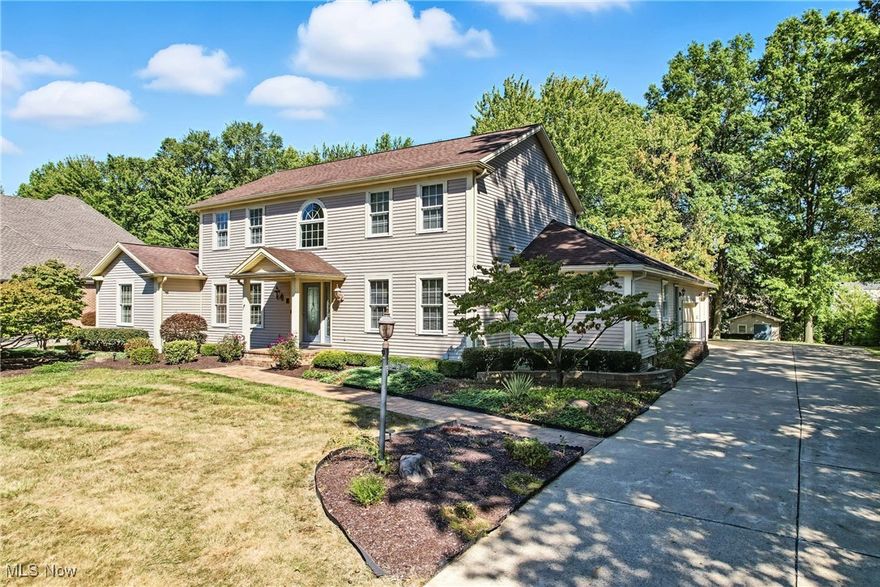 New Price, Must see the photos. Large CANFIELD home with a 925sq.ft  IN-LAW SUITE  features a living room, a dining room, a kitchen, a large bedroom with custom closets and a full bath, and private entrances to the Great room and basement.  This PHENOMENAL four bedroom, four and a half bath home on a large lot, with easy access to all highways and shopping The home features all-new lighting. The White Kitchen features newly refaced cabinets, new appliances, granite countertops, and a desk area, all complemented by a ceramic tile floor. The living room features a wet bar and a fireplace with gas logs, and provides excellent traffic flow to the rest of the home, with entrances to the kitchen, sunroom, and great room. The exceptional Great room features numerous windows and two sliders that open to the wooded outside wrap-around deck. The Sunroom off the kitchen is home to a walk-in pantry and an additional sliders to the outside deck and patio. Also on the first floor, you will find a formal dining room, an office, a laundry, and a half bath. The large Master bedroom, located on the second floor, includes a walk-in closet and a stunning marble bath, dual sinks, a spa tub and separate shower. There are two additional large bedrooms with custom closets and a full bath on this floor.  The lower level features a cozy recreation/family room that includes a wet bar, exercise area, and full bath. There are also two storage areas with shelving. The heated garage has extra storage and an epoxy floor. The back of the property is wooded with landscaping lighting, many annual plants, and a functional shed, the size of a one-car garage. There are many more high-end elements, such as new front and side doors, Central Alarm, Central vacuum, furnaces zoned with a UV lighting system, Whole-house surge protector, and Intercom speakers.