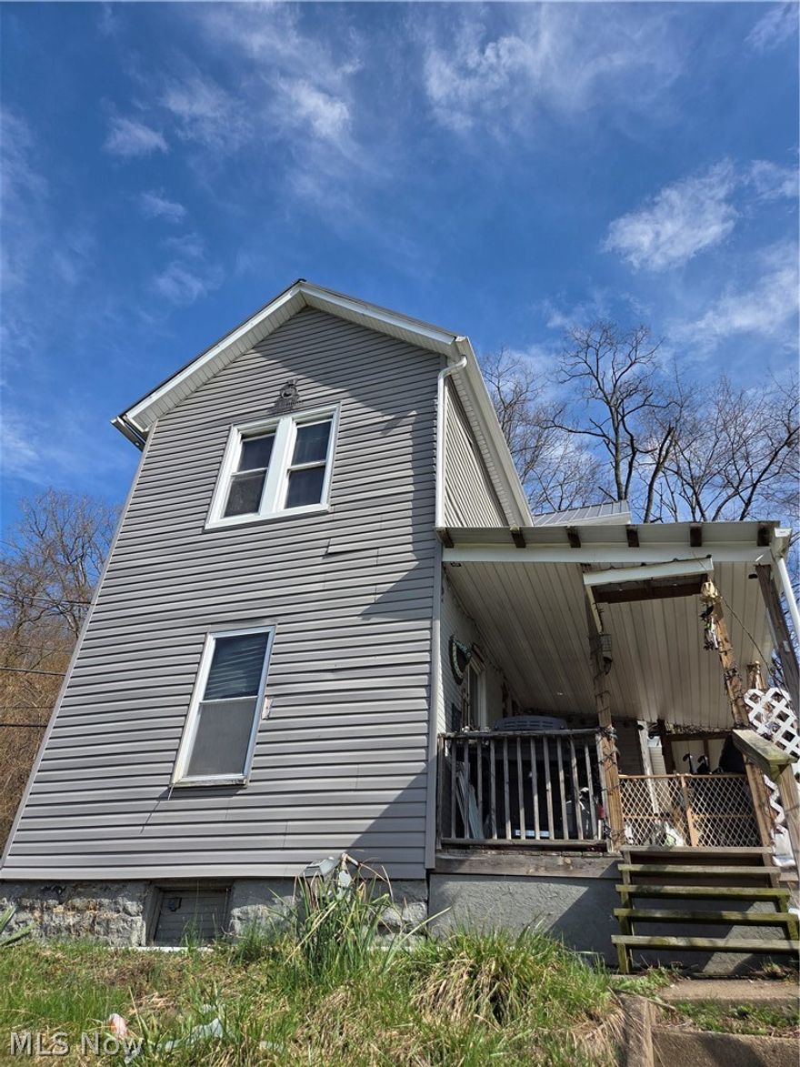 This home offers 2 bedroom and one bath, with 5 parcels to enjoy.  Sitting along the foothills in Chester WV opportunity awaits. This fixer upper needs your special touch.  Some items already updated including windows, partial metal roof, HVAC, and AC.