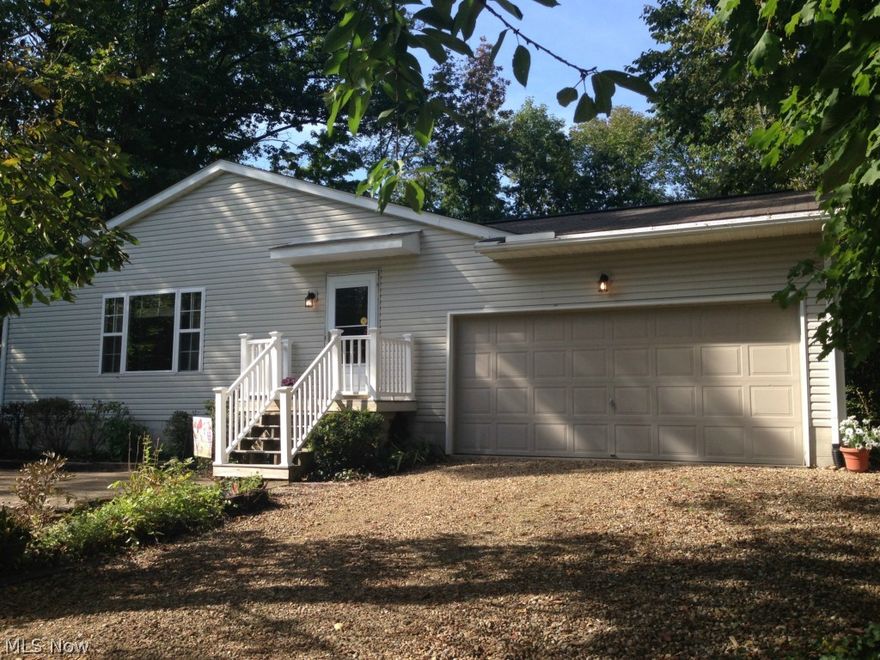 Welcome to Cinnamon Lake! This charming 3 bedroom, 2 bath ranch is much larger than it appears with 1692 fin. sq. ft. of living space, plus a large basement and sensible crawl space. Located across from beach #4 on the north side of Cinnamon Drive, this home offers beautiful year-round views of the lake. The great room features a large picture window and propane fireplace. Open to the kitchen and dining area, you’ll appreciate the ample cabinetry and counter space with extended countertop for casual dining. The 1st floor laundry room has sliders that lead to a covered porch and fenced courtyard. Woods to the rear and side of the home offer great privacy in this tranquil setting. You’ll enjoy relaxing on your front patio with recessed fire pit as you enjoy all the wonderful sights and sounds of living in Cinnamon Lake. The lake encompasses 135 acres and the development offers use of the expansive lodge, heated pool, tennis and basketball courts, multiple beaches, picnic pavilions and pl