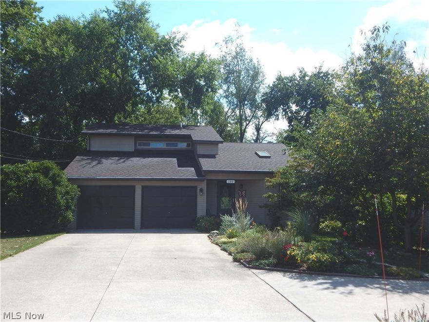 This stunning 3 bedroom, 3.5 bath contemporary home is nestled on a wooded lot with wrap around decks to relax and enjoy the views.  The first floor master suite boasts a private bath with granite countertops,  tiled shower, custom built-ins, and access to private deck.  Stainless steel appliances, conduction oven, granite countertops, and a tiled backsplash are features of the updated kitchen. The great room offers a fireplace with custom mantle, tiled hearth, and cathedral ceilings with skylights.  Spacious dining room is perfect for entertaining.  Two additional bedrooms and full bath are located on the second floor.  Partially finished, walkout basement includes a bedroom, office, full bath,and private patio.  Additional 2 car detached garage with separate workshop and deck space. Close to trails that connect to Holmesbrook Park.  This home is a nature lovers dream!