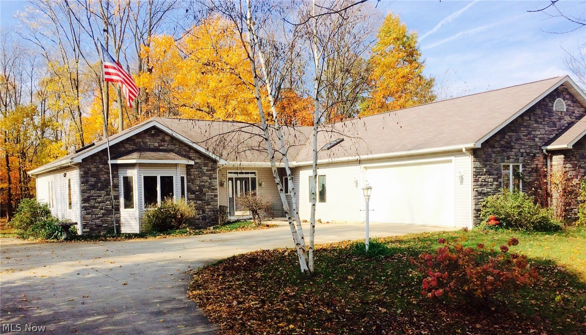Enjoy this Ranch home located in Lake Township and nestled away on a mostly wooded lot, with a large backyard. This home has an amazing feature; the entire home was designed with wheelchair access to everything. This incredible home offers a walkout unfinished lower level, an oversized 2 car garage, 3 bedrooms which all include oversized closets, 2.5 baths, open and spacious great room, and a sitting area. Enclosed porch off the sitting area and/or master bedroom, complete with a large hot tub. Home also offers plenty of storage. The lower level has the 2nd fireplace. A must see, this home will wow you will all of its unique accomodations.
HOME WARRANTY PROVIDED