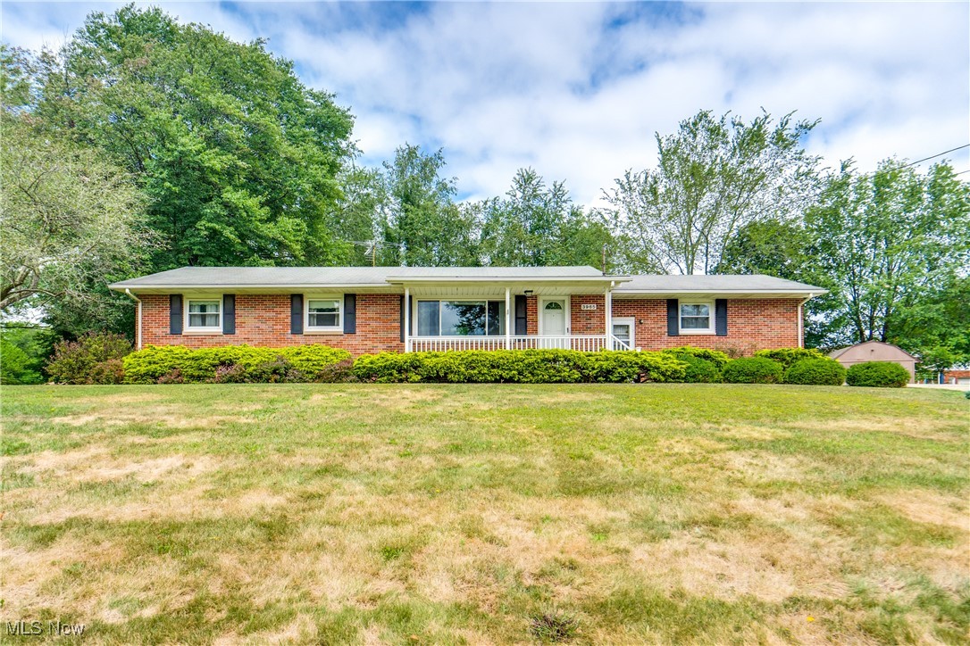 Welcome to this charming brick ranch home featuring three bedrooms and 1.5 baths. As you step inside, you'll be greeted by a spacious living room with a large picture window and vaulted ceilings. The open layout flows seamlessly into the dining area, which provides convenient access to the back deck—perfect for indoor-outdoor entertaining. The well-appointed kitchen boasts vinyl flooring, laminate countertops, and a breakfast bar, making it a wonderful space for meal prep and casual dining. Down the hall, you'll find three nicely sized bedrooms, including the master bedroom, which offers the added convenience of its own private half bath. The full hall bath features ample cabinet space and a single vanity. Outside, the front porch overlooks a lovely front yard, while the two-car attached garage ensures plenty of parking and storage space. The large backyard is a true highlight, complete with a back deck for relaxing or hosting gatherings and a shed/outbuilding for additional storage. Plus the home is minutes away from parks, shopping, and schools. Don't miss your chance to see this wonderful home; schedule your showing today!