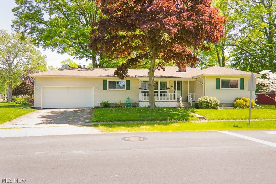 Looking for a ranch with hardwood floors, updated kitchen, baths and plenty of windows for natural light? This sprawling ranch is centered on the lot. The two nice size yards located on each side of the home, make up for the lot not having a traditional backyard. South yard is shaded and has a shed with a concrete pad that could be used as a workshop. Relax on the covered front porch. Spacious living room has three large windows along with built in shelves and open to nice size dining room. Plenty of  counter space in the remodeled kitchen with granite counter tops, spacious cabinets and two nice size windows. Full bathroom has been remodeled including updated electrical. All three bedrooms are nice sizes with hardwood floors. Enjoy the convenience of the first floor laundry and mud room with a half bath, door to the side yard, along with an entrance to the two car garage so you can stay dry during those cold winter and rainy days. Unfinished basement has endless possibilities with a w