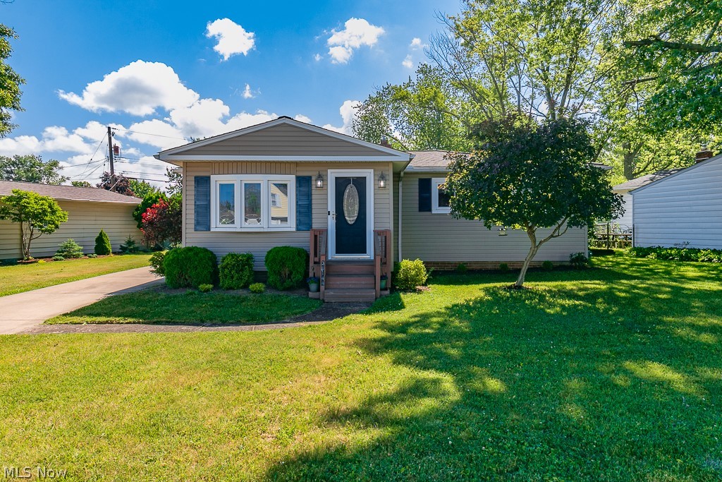 Welcome to 30144 Ridgeview Dr., a beautifully fully remodeled Ranch home in the heart of Wickliffe, Ohio. This charming home has been meticulously updated, offering modern amenities while maintaining its classic appeal. The exterior of the home features new vinyl siding from 2008, a brand new roof installed in 2020, new windows from 2020, and to ensure year-round comfort, a new furnace and air conditioner were added in 2023. As you step inside, you'll be greeted by a morning room that showcases a perfect blend of planked flooring and carpet, all highlighted by a vaulted ceiling. The open living room flows seamlessly into the eat-in kitchen and dedicated dining area, creating an inviting space for both relaxation and entertaining. The kitchen has been tastefully updated with newer cabinets, modern stainless steel appliances, vinyl plank flooring, corian countertops, and a stunning ceramic backsplash.The main floor boasts three bedrooms, each thoughtfully designed to provide comfort and style. The updated bathroom features newer paint, contemporary fixtures, a vinyl shower surround, and vinyl plank flooring, adding a touch of luxury to your daily routine.The lower level of the home offers additional living space with a fully finished recreation room and a bonus game room, perfect for entertainment and leisure. The utility room provides ample storage space, and a second bathroom on this level adds convenience for family and guests.Outside, the home's exterior is perfect for entertaining with its updated and beautifully landscaped yard. The spacious backyard features an attached wooden deck, over 200 square feet in size, providing a serene space to relax and enjoy the outdoors. A full-size two-car garage adds to the home's convenience and functionality.Whether you are looking for a comfortable family home or a stylish space to entertain, 30144 Ridgeview Dr. offers everything you need and more. Don't miss the opportunity to make this exceptional property your new home.