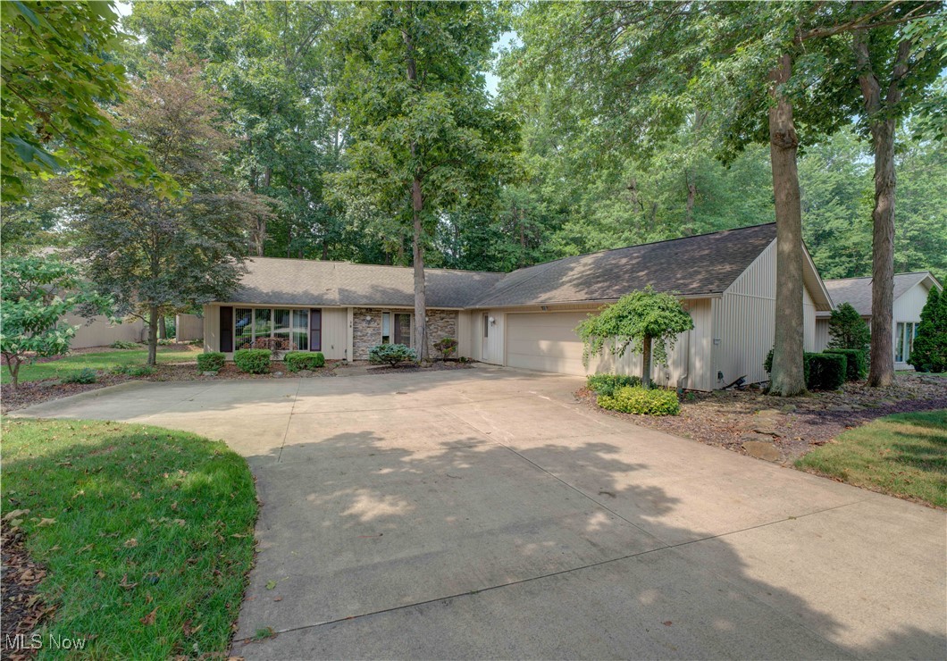 Don't miss this 2638 square foot home situated on a 245 ft. deep scenic and treed lot! Entry that opens to a large Great Room with cathedral ceilings , fireplace and floor to ceiling windows that view the 245" deep scenic lot. Large kitchen with all appliances, planning desk, 3 pantries, ceramic tile floors and granite counter tops, cathedral ceiling and a small built-in entertainment center for your kitchen TV and a door that opens out to the rear patio. The Master Bedroom has a walk-in closet with his and hers built-in wardrobe chest, patio door that opens out to the rear patio, master bath with soaking tub, walk-in shower, ceramic tile floor, double sinks with granite counter tops. The second bath has a built-in jacuzzi/soaking tub, granite counter tops and ceramic tile floor. There are two other generous sized bedrooms. Call now to schedule your private showing.