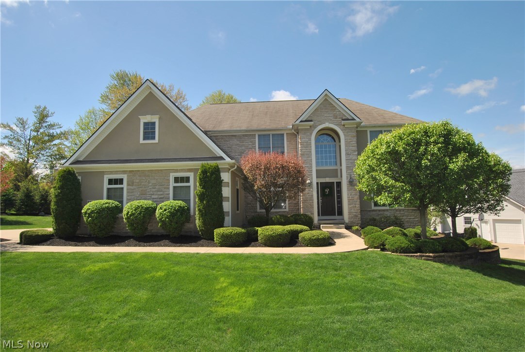 Stunning custom built home by Petros Homes. 1 owner, true pride of ownership. Shows like a model! Professionally decorated w/custom window coverings, neutral décor throughout. 2-story foyer w/2 staircases to 2nd floor, wood floor. Living room w/tray ceiling, crown molding. Elegant formal dining room w/tray ceiling, chair rail, wood floor. Gorgeous 2-story family room w/wall of custom windows & fireplace. Spectacular large kitchen w/custom cherry cabinets, granite counter tops, newer backsplash, newer dishwasher and refrigerator, stainless appliances all stay, island, pantry. Mud room 6x6 w/newer locker and floor. 1st floor laundry room w/newer floor. FLR 2: luxury master suite w/tray ceiling, sitting room 11x9, 2 walk-in closets 11x8 and 9x6, newer custom California Closets, glamour bath w/2 vanities, makeup area, newer granite counter top, newer custom tile shower. Main bath w/newer granite counter top. 3 additional bedrooms; 1 bedroom w/crown molding & chair rail. Newer 2012, finishe