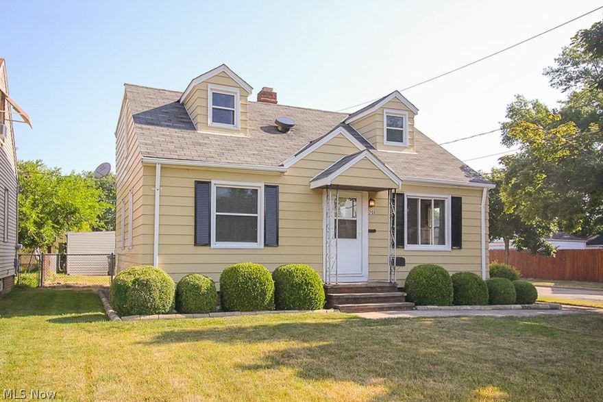 Expanded Cape Cod bungalow extremely clean and well maintained, ready to move in! Large eat-in kitchen with natural wood cabinets and no-wax vinyl floor, plenty of hardwood floors w/ wall to wall carpeting on 1st floor. 2 full baths recently updated. All bedrooms are generous in size! Spacious quiet corner lot. Brand new central a/c system and hi-efficient gas FHA furnace! Trendy and large tudor-style finished recroom and retro pub area. Additional workshop/utility area included. Larger 1.5 car garage w/ newer Craftsman opener.