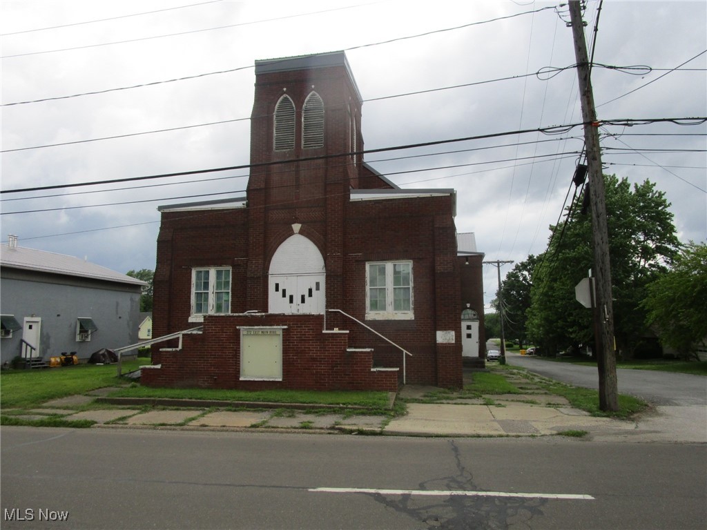 This is a lovely old brick Church on a large, corner lot in a great location. Its close to Route 90, Route 20 and historic downtown Conneaut. The Lot is L shaped & provides plenty of parking space. The large sanctuary is approximately 34 x 56 & would probably seat 150-175 people. On the main level are several rooms which would be great for office or classroom use. The lower level features 2 half baths, 1 full bath, a kitchen & a large social hall/cafeteria/conference area (approx. 32' x 40). In addition to that large area, there are several more classroom/training rooms at your disposal. The seller added the new 40 year metal roof in 2013 and also the ventless gas heater in the kitchen. It has currently been taken down to the studs, plumbing is only operable in one of the bathrooms, there is no heating source and power is off. Water is currently on. The building needs a lot of repair and clean-up - use caution when viewing. Come see it - put your imagination to work & restore this classic old brick building to her former beauty! Large parking space in rear offers plenty of room for visitors and guests.