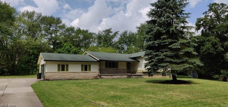 Tons of potential and space in this 3 bedroom split level!  It's like rural living in the middle of the suburb, large lot - over half an acre, 2 car attached garage, front porch, walk out basement and much more.  Come and make this your own today!  This is a Fannie Mae property