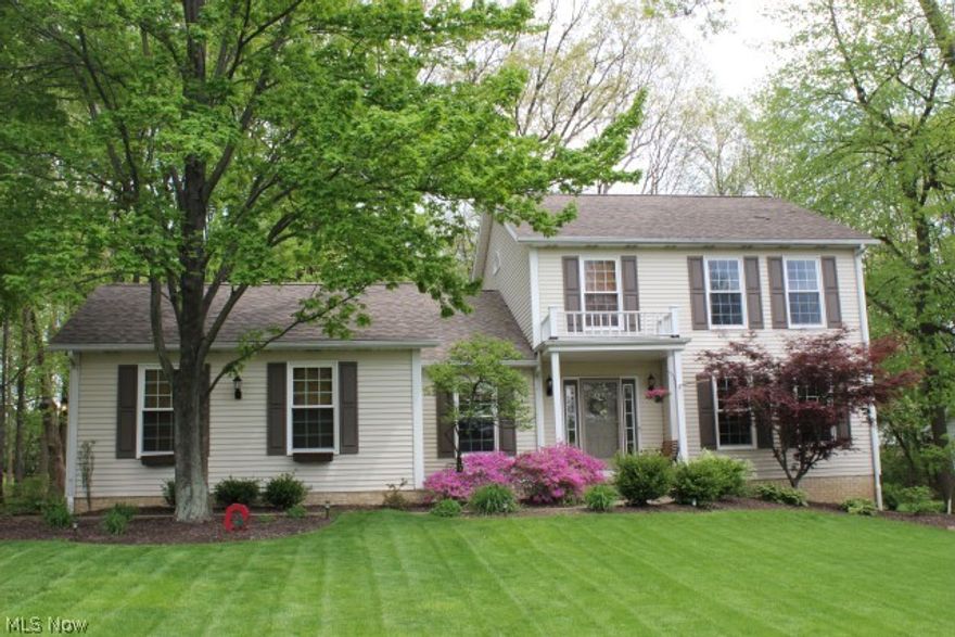 Absolutely beautiful-Inside & Out! Custom built w/much attention to detail* 2956SF including 700SF in finished lower level* Vaulted family room w/new patio door (2013) & wood burning fireplace w/gas starter* Vaulted 1st floor den w/wall of built ins (could be bedroom if needed)* Eat in kitchen w/Kraftmaid cabinets, large pantry, ceramic floor, roll out shelves, updated appliances (refrig, range, DW, microwave) & disposal* Formal dining room* Vaulted master* Outstanding laundry room w/built in cabinets, ironing board & work center* Lower level rec room & additional bedroom or office, light & bright* Generous 2 car side load* Updates roof & softener(2yrs), furnace & H2O (5yrs), roof (2011), windows (2yrs), deck (6yrs), downspouts/drainage (2012)-all dates/yrs are approx.* Park setting treed & private w/deck, play area & 10x12 out bldg.* Many extras* A pleasure to show!
