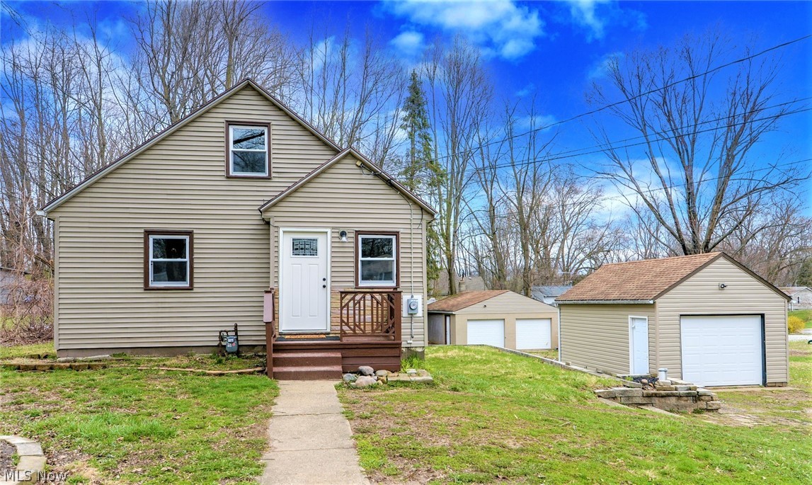 *Completely REMODELED Home In Springfield Township W/1,450 Sq. Ft Of Finished Living Space Includes 3 Bdrms, 1 Full Bathrm & Partially Finished Walkout Lower Level On .41 Acres!! **Auto Lovers, Mechanics This Is For You --> 2.5 Car (Almost 700 Sq. Ft) Oversized Detached Garage PLUS 1 Car Detached Garage!! *Updates Include: NEW VINYL WINDOWS, FURNACE, Plumbing, ELECTRICAL Including Panel, ALL Garage Doors & Entire BRAND NEW Interior! *LUXURY Plank Flooring Throughout *Grey Walls, White MODERN Trim *Walk In To A Living Rm OPEN To Kitchen That Features Brand NEW Fresh White Arcadia Shaker Style CABINETS, New Stove & Dishwasher, Beveled Edge Countertops W/Backsplash, Subway TILED Wall Backsplash, Faucet W/Sprayer & Stainless Sink. Black Led Flushmount Lighting *TWO First Floor Bedrooms *Sleek Full Bathroom Includes A NEW Bathtub & Surround, Black Rain Shower Head & Faucet, White Vanity/Countertop & 4 Sconce Lighting *Upstairs Features A Large Master With Ample Space For A Bed + Set Of Dres