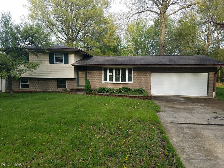 Supersized split-level home at the end of a dead end street. The home features 3-4 bedrooms with a huuuuuge master bedroom and master bathroom. The main level has a somewhat open concept and includes a large living room, dining room, and a nice kitchen with large windows and a sky light. As you go down stairs you will find a bonus room that would make a great office or additional bedroom, a family room with a wood burning stove, and off the family room is a sun room. The basement is also semi-finished providing even more usable space to this already to this already huge home. And the outside has a lot to offer as well. A fenced in back yard for you furry four legged friends. A private wooded view. A large deck that would be great for entertaining and cookouts. And a large workshop/barn (aprox 22x22)