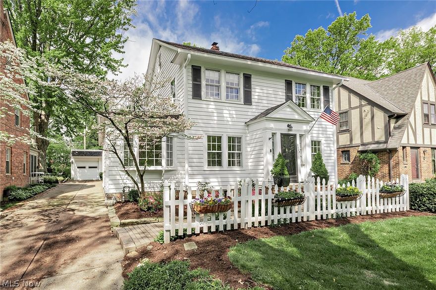 Welcome to this exceptional 5-bedroom, 3 full and 1 half bath home nestled on desirable Ashurst Road in the heart of University Heights. Blending timeless charm with expansive living spaces, this beautifully maintained residence offers the perfect balance of character, comfort, and functionality.  A thoughtfully designed two-story addition creates an impressive main level family room and a spacious primary suite retreat above. The oversized eat-in kitchen is truly the heart of the home, featuring abundant workspace, stainless steel appliances, Thermador double ovens, dual sinks, and two pantries—ideal for everyday living and entertaining alike. Traditional living and dining rooms, an inviting sitting room, and a sun-filled 3-season room provide versatile gathering spaces throughout the main level. Fresh, neutral carpeting in many rooms offers a move-in ready backdrop for any style.  Upstairs, the second floor hosts the expansive primary suite, three additional bedrooms, a second full bath, and the convenience of a dedicated full laundry room. The finished third floor includes a private bedroom and full bath, making it an ideal setup for guests, teens, or multi-generational living.  Outside, professionally designed landscaping surrounds the property, while the backyard unfolds into a hidden English garden oasis—peaceful, private, and truly enchanting. Completing the package, this home is Point of Sale compliant with the City of University Heights, offering added confidence and peace of mind for the next owner.