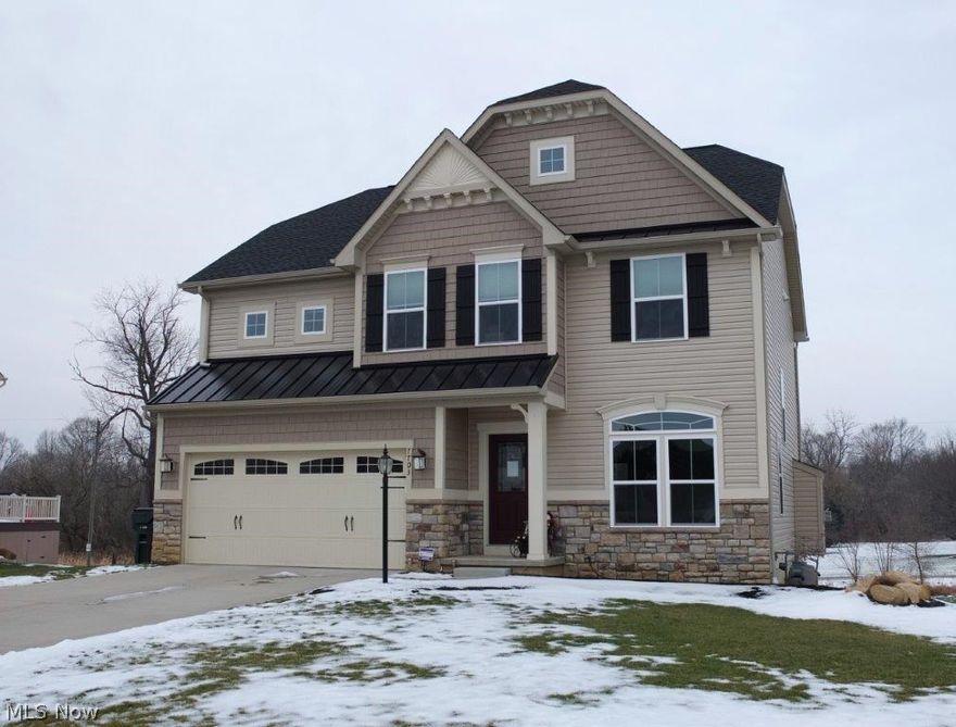 Amazing find! 2-year-new 4 bedroom, 2 full, 2 half bath home with a finished lower level and a serene backyard! Wonderful open concept with a great room, morning room and kitchen. The great room has a gas fireplace with wiring for a TV above. The morning room has vaulted ceilings, tons of natural light and a slider to the back deck. Stunning kitchen offers granite countertops, upgraded cabinets, easy slide out drawers, a large center island, wood flooring, breakfast bar, pantry, tile backsplash and stainless steel appliances! The foyer is open to the quaint living room with beautiful wood flooring. Convenient half bath on the main level with a pedestal sink. Spacious master suite has a 12x6 walk-in closet and private full bath with a dual sink vanity, Jacuzzi tub, tile flooring and shower surround. Three additional bedrooms, a full bath and a laundry room complete the second level. 2-car attached garage, too. The finished lower level is wired for surround sound and has a half bath, a r