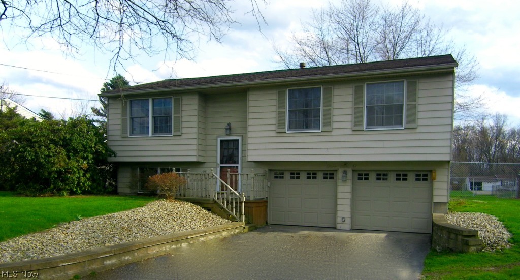 Move right into this cozy three bedroom home in a quiet Champion neighborhood! Quick access to the highway, shopping, schools, and parks. Just two blocks from the Western Reserve Greenway Trail/Bike Path. Updates include: Remodeled kitchen and bathroom, fresh paint, new windows, and all appliances stay! Laundry room includes a newer hot water tank and furnace with a spacious family room on the lower level. Enclosed porch off dining room leads to a large fenced-in backyard. Motivated seller! Call for a private showing today!
