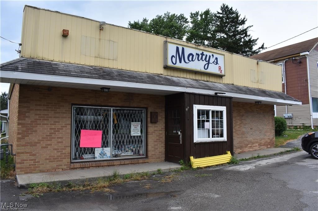 This commercial property offers the best of all worlds with a storefront that could house most businesses or be converted to apartments as well as a triplex fully rented bringing in over $2000 a month. The store (which used to be Marty's Drug Store is currently home to an indoor yard sale and has endless possibilities for the creative business owner.