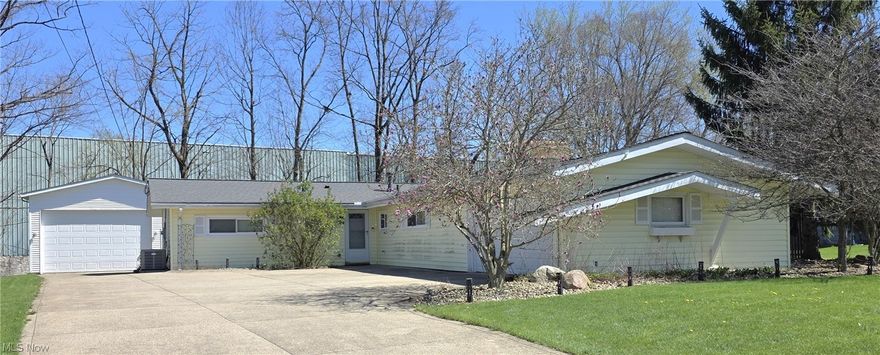 Welcome Home to 9061 Cranbrook Drive, Located in the Award Winning Nordonia Hills City School District! This Beautiful One Floor Living, Ranch Home is Tucked Away in a Peaceful Northfield Neighborhood. This Move-In-Ready Residence Blends Comfort, Style, and Function Across Every Room. Step inside to find a Bright, Open Living Area with Large Windows that Fill the Space with Natural Light and overlook the Private Backyard which is Partially Fenced. The Eat in Kitchen features All Major Appliances, Ample Counter Space, and Lots of Cabinetry, Perfect for both Everyday Cooking and Entertaining. This home offers Three Bedrooms including an Owner's Suite with an Attached Half Bath. There is also a Hall Full Bath providing Convenience and Comfort. An Additional Family Room has a Stone, Wood Burning Fireplace and French Doors that lead out to a Secluded Patio. The Attached Garage is Conveniently Located and will keep your Vehicles Safe and Dry in the Ohio weather.  An Extra Large, Double Height, Additional Garage (24’-30’) has Heat, 220 Volt Power, Water and provides Plenty of Space for Projects and Storage. The Generously Sized Driveway has room for Many Guests and Vehicles. Located Just Minutes from Restaurants, Entertainment, Shopping, and Schools.  I-271, I-480, I-80 (Ohio Turnpike), SR-8. 20 Minutes to Downtown Cleveland or Akron. This Home Offers the Perfect Balance of Suburban Peace and Everyday Convenience. Don’t Miss Your Chance to Call This Northfield Gem Home — Schedule Your Private Showing Today!