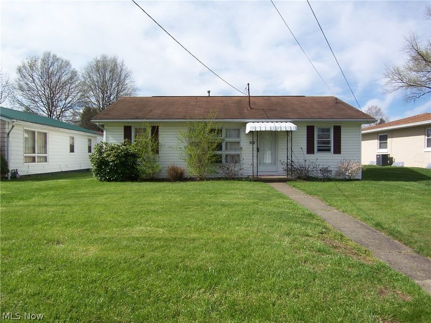 Newer kitchen and appliances, flooring.  Alley access and can park in back of house.  Storage building.  Does not need flood insurance.  Remodeled home.