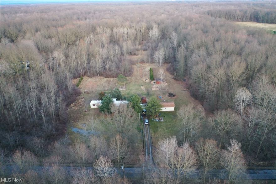 This beautiful property features mature timber, nice shop, and adjoins the western reserve greenway trail. As you enter the property, you will find a mobile home and a newer 16'x34' shop/shed. The property has a great mix of mature timber, open areas, and thick cover. As you walk the property, a ton of deer sign is seen throughout. If you like biking or walking, there is easy access from the back of the property to the western reserve greenway trail! An excellent location close to Mosquito Creek Lake and the Grand River Wildlife area.