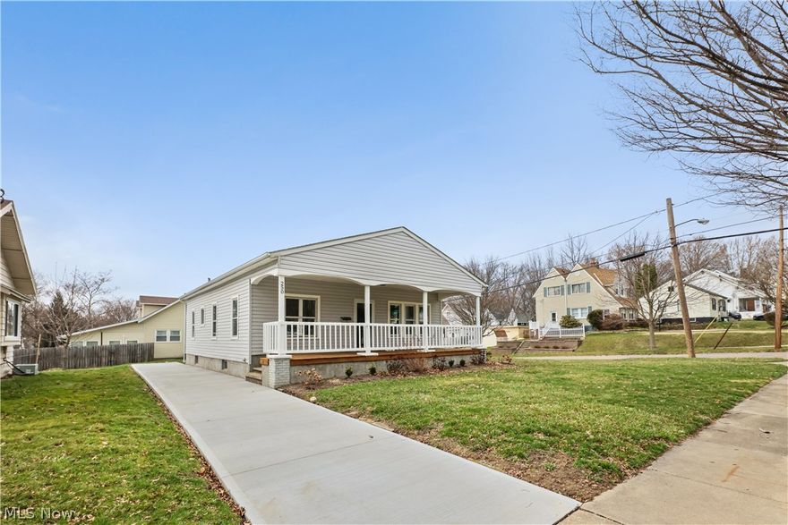 STUNNING remodeled home! With attention to detail, this home has everything for your personal comfort and is move in ready. The original woodwork is beautiful and mixes perfectly with the modern floorplan and finishes. Numerous updates include a new opening for the kitchen/dining room, new kitchen, bathroom, furnace, C/A. New floorcoverings feature PLUSH carpeting and wood laminate. NEW concrete driveway, garage door and opener. Enjoy a large front porch that is semi private for entertaining or simply enjoying long summer evenings.