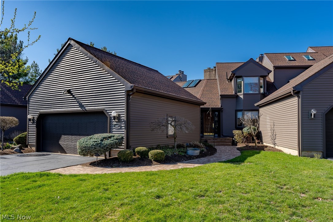 This is the lake front condo you have been waiting for! Enjoy the multi-level deck with stunning views of the 144 acre lake and a walkout the lower level! When you walk in the front door you are greeted by stunning vaulted beam ceilings and open concept living. The great room features a stone fireplace and the kitchen has stainless steel appliances and granite countertops. Additional family room with a fireplace in walkout lower level. 1st floor laundry and attached 2 car garage. Maintenance free living. Buy now and enjoy all summer long!