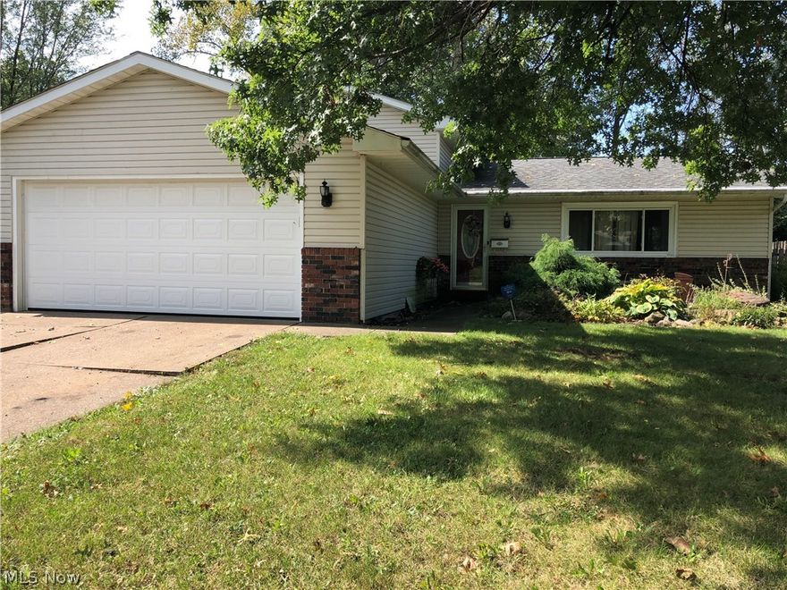 Beautiful Split level home.  Private fenced back yard with patio. No rear neighbor. Lots of major updates and improvements already done for you!  Main floor remodeled with new hard wood floors and arched entry ways.  Enjoy 4 large bedrooms and 2 full bathrooms. New Pella windows in '08.  Newer roof, and gutters with gutter guards in '08.  Newer vinyl siding and shutters '12. Newer exterior doors '11.  Newer wood floor in the living room, dining room, and kitchen '11.  Perfect Galley kitchen with hard wood floors, newer counter tops and sink with newer faucet.  All kitchen appliances stay.  Formal dining area with hardwood floor, newer sliding door to the back patio for grilling and relaxing in the private back yard.  Newer furnace and Central Air in '13, and new hot water tank '15.  Nice sized 2 car garage with newer garage door '16.  Installed water softener and water filtration system in '16.  Security system.  Great deal for this very well-built, quality home.  Close to restaurants,