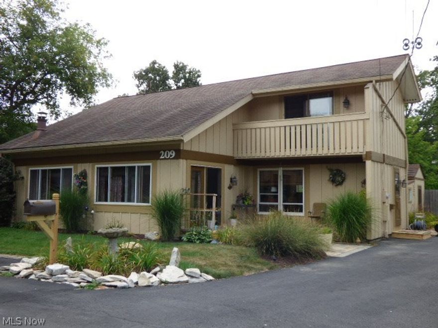 Peeks of the Lake with Beach Access at the end of this Private Street.  Well maintained home with vaulted ceilings in the Great Room and upstairs Bedrooms.  Fully applianced kitchen with large pantry space.  First Floor Laundry.  Four Bedrooms with One on the Main floor, currently used as an office.  Two more up and one down.  Rec Room Down could be a Fifth Bedroom.  Lots of storage and ample parking.  Fenced back yard with small deck.  Stamped front patio for Lake views.  Walk to the Lake at the end of the Street.  Note: Butcher block to L of sink will be replaced by like material