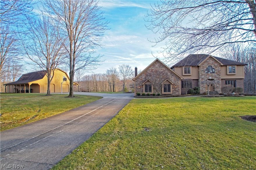 Imagine owning a private retreat on 24+ acres w/manicured entrance as you wind through 1100 ft long concrete drive passing 2 of 4 gleaming stocked ponds, open fields & hideaway paths to enjoy your own nature preserve. Entertain in style indoors or enjoy BBQ's from rear paver patio & panoramic views of pond for swimming, complete w/dock. This custom built brick & stone spacious home is a chef's delight w/light filled larger kitchen renovated in 2011 to include upgraded appliances, custom built cabinets, granite counters, travertine back-splash & ceramic tile floors, dbl sinks & ovens & built-in wine cooler. Open design flows to great rm or formal dining makes for easy entertaining. You'll love the hickory wood floors flowing through most of main floor to great room, living rm, dining rm & library/office. Relaxing in the great rm is easy w/gas fireplace, wet bar & coiffured ceilings. An expansive owners suite w/15x16 spabath soaking tub, 12x8 closet & built-ins is hard to leave. All 3 fu