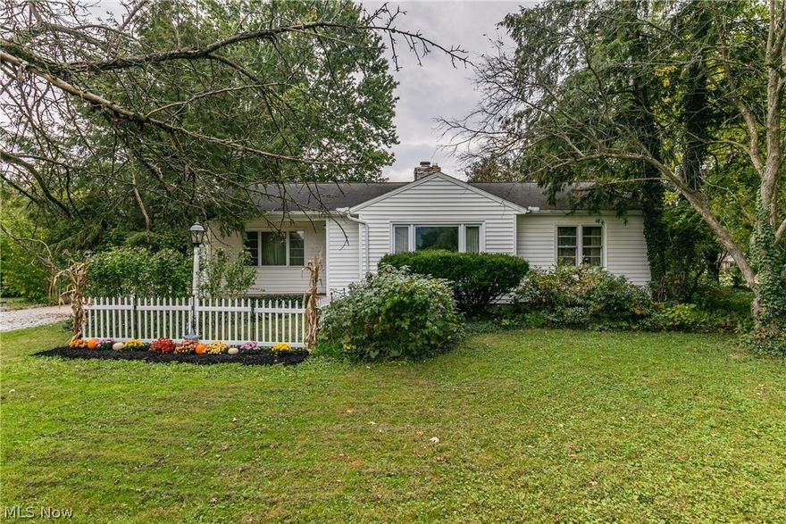 Lovely 3-bedroom, 1.5 bath Ranch with a 2 car attached garage, situated on a .56 acre corner property! Beautiful wood floors flow throughout the light & bright living room w/ wood burning fireplace, delightful formal dining room w/ built-in cabinet & all 3 comfortable bedrooms. You will love cooking your favorite meals in the large country style eat-in kitchen, complete w/ sprawling island w/ seating, white cabinetry w/ lighting, ample prep space, pocket doors & included appliances. There is a full & half bath that complete the main level. Full basement with laundry area & tons of storage space! The yard boasts mature landscaping that adds ample privacy, plus a large patio for backyard BBQ's. Brand new septic(2021). Call today for a private showing and see what this great home has to offer!