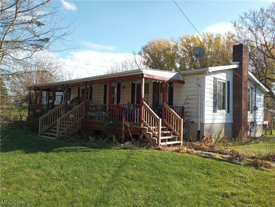 Manufactured home built in 1973 and placed on permanent foundation in 1992.  Sits on approximately one acre in Sullivan.  Porch on front and deck at back of house.  Most windows replaced in 2015.