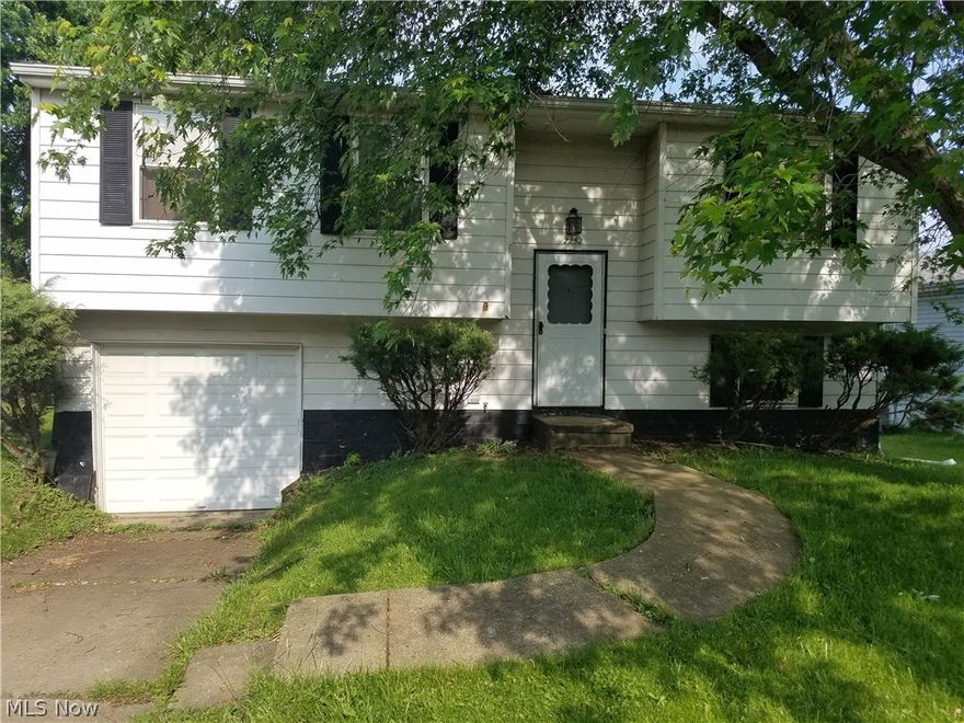 This cozy bi-level has everything you need in a house.  It features both a living room and family room, a possible 4th bedroom on the lower level, 1.5 bathrooms, an attached garage, and a deck overlooking the huge fenced in back yard.  The house could use a little TLC, but should be a great opportunity for the right buyer.  Easy to show!