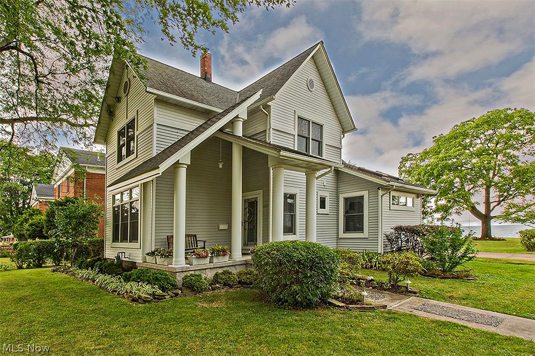 Enjoy beautiful Lake Erie views in this gorgeously remodeled home situated on nearly one acre of picturesque lakefront property. Quality renovations made throughout the years include vaulted ceilings, skylights, professionally designed lighting, and custom Andersen windows. Enter the slate tile foyer and be greeted by a living room featuring hardwood floors. The open kitchen showcases Kraftmaid cherry cabinetry, a breakfast bar, and stainless steel appliances. The kitchen opens up to a sunlit dining area with vaulted ceilings, skylights that open, and doors leading out to a brick patio. An additional bedroom with French doors, great for an office, and a remodeled bathroom with a jetted tub can be found on the main floor. The first floor also offers a convenient laundry room off the kitchen. Upstairs, the master bedroom with separate closets has a gorgeous view of the sunrise and sunset with its vaulted ceiling. Two more bedrooms and a hall bathroom complete the second floor. Outside, r