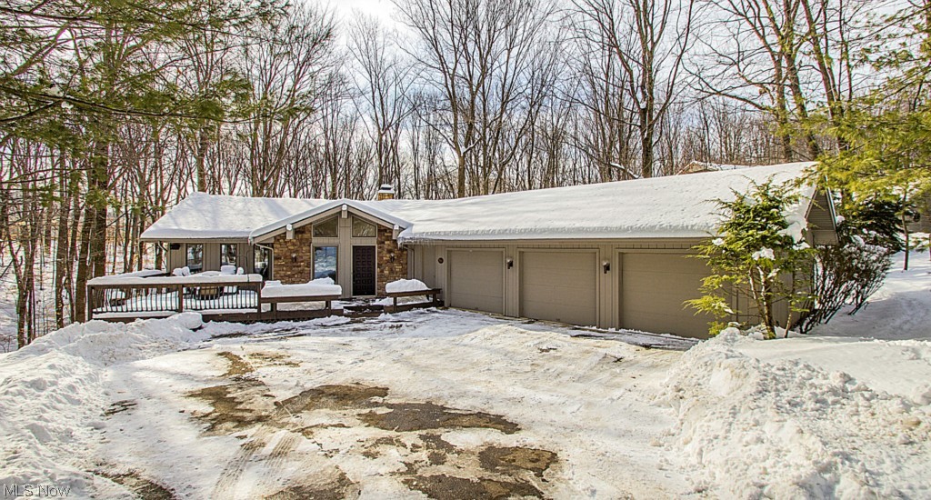 Tastefully updated, one-of-a-kind Ledgewood beauty! One of the very few custom-built homes with a walk-out lower level. You will enjoy the private cul-de-sac street w/ a park-like setting nestled on this serene lot. Gourmet eat-in kitchen with granite counter tops, large walk-in pantry, hand-scraped hardwood floors and stainless steel appliances. The dual-sided fireplace is situated between the kitchen and massive great room with vaulted ceilings, sky lights and an updated wet bar. Walk out to the backyard w/ two-tiered deck & peaceful wooded views; or relax on the separate front deck. The 3 over-sized bedrooms are all located on the above grade lower level featuring the private master retreat that boasts a cozy fireplace, walk-in closet, slider to the lower level deck and en-suite glamour bath w/large jetted tub and separate shower. Improvements include new gleaming hand-scraped hardwood floors, granite top wet bar, plush living room carpet, ceramic tile in guest bath, Hot Water Tank