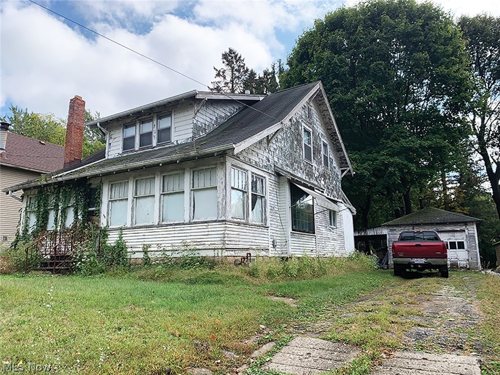 Two Story Fixer-Upper Home With Two Detached Garages – 60 X 200 Lot – Lake Local Schools – Lake Twp. - Family-owned for years, been vacant and needs updated. ABSOLUTE AUCTION, all sells to the highest bidder on location: TUESDAY – NOVEMBER 5, 2019 – 11:00 AM, REAL ESTATE SELLS AT 12:00 PM. Nice lot with rear access also from the rear alley. Built 1919 – 1,278 sq. ft. – three bedrooms and bath up – expanded kitchen – living room, family room with bay window, den with brick fireplace and Knotty pine, enclosed porch, wood frame, full basement, gas heat, detached one car plus side covered patio – rear one car with side carport – storage building – great area – needs TLC. TERMS ON REAL ESTATE: 10% down auction day, balance due at closing. A 10% buyer’s premium will be added to the highest bid to establish the purchase price, which goes to the seller. Any desired inspections must be made prior to bidding. All information contained herein was derived from sources believed to be correct. Infor