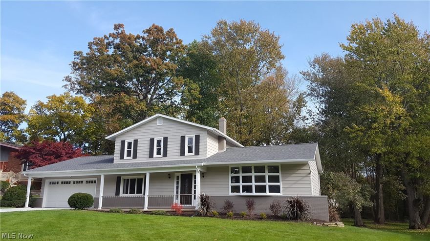 Absolutely nothing to do here but admire this gorgeous 4 Bed 3 Full Bath 4 level Split Level home that has been totally redone, restored, remodeled, and landscaped.  As you park on the new concrete driveway you'll notice the new roof, garage door, front door and exterior paint.  It gets better. As you enter into the newly tiled foyer, you'll see the refinished and new wood floors in the living room, dining room and kitchen, cathedral ceiling, new lighting and fresh paint.  Then, there's the stunning remodeled kitchen with new soft close cabinets, granite counter tops and stainless steel appliances.  The kitchen overlooks the carpeted fire placed family room. Doorways have been enlarged to capture the open concept design.  There is a separate first floor bedroom with a full remodeled bath.  The second floor has a master bedroom with fabulous en suite master bath.  Also there are 2 additional guest bedrooms and a third remodeled full bath.  The huge walk-out basement has an additional fi