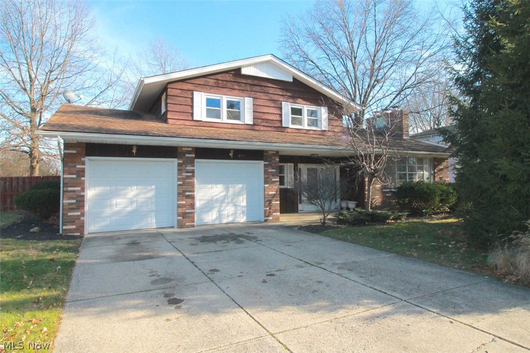 Welcome to this beautifully maintained four bedroom 3.5 bath split level home. Freshly painted with newer carpeting, electric paneling, newer vanities in the second first floor bath and walk in showers; upstairs baths have been remodeled as well. Newer light fixtures and toilets, first floor bath completely remodeled. This home is the original model home, with an In Law Suite but that's not all, windows are vinyl double hung, recessed lighting and extra large sliding glass doors to name a few. Spacious kitchen offers a countertop range, and a double oven for all your baking and cooking needs, lots of counter space along with cabinets for storage. Spacious eating area off the kitchen which flows into the dining room and living room area with a cozy wood burning fireplace to enjoy on these cold winter days and nights. First Floor Bedroom could also be used as an office with a private bath. Great home for entertaining as well and a gorgeous yard complete this home. A patio in the b