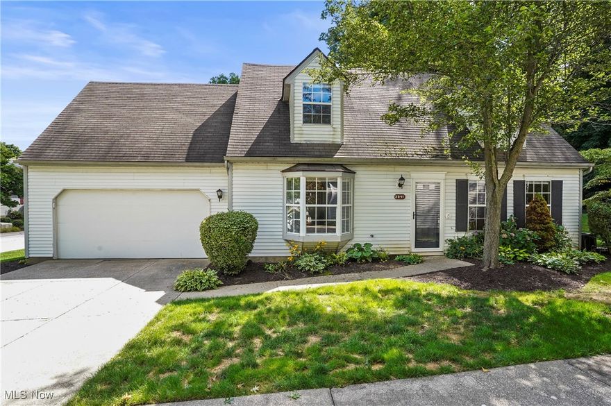 Beautifully updated, stunning 3/4 bedroom, 2 full bath condo in the Tinkers Lane development! Practically every inch of this condo has been upgraded with neutral, contemporary colors and finishes! Spacious living room and dining room with newer wide plank LVT flooring which flows right into the incredible kitchen that is sure to impress. Boasting custom cabinets and quartz counters with a gorgeous waterfall edge, subway backsplash and SS appliances, cooking will be a dream! The opening to the living room with a quartz breakfast bar is perfect for extra seating. The sliding door leads to back patio, to enjoy the scenic wooded view. First floor living is possible with a spacious bedroom w/ walk-in closet and luxurious bathroom with an impressive tiled shower and newer shower door.  A laundry/utility room is off the kitchen and attached 2 car garage and includes the washer and dryer. The second floor features 2 large bedrooms, one of which has a massive bonus room attached. Endless possibilities for this bonus room including a 4th bedroom, office, playroom or dream closet! A second full bathroom with beautiful tile work and a tub complete the 2nd level. Custom blinds and shades throughout. Recent updates include solid core interior bedroom, bathroom and closet doors, all trim paint and LVT flooring. HOA includes snow and trash removal, landscaping and roof and exterior building. Close to shopping, dining and freeways. Twinsburg Schools. Move right in and enjoy!