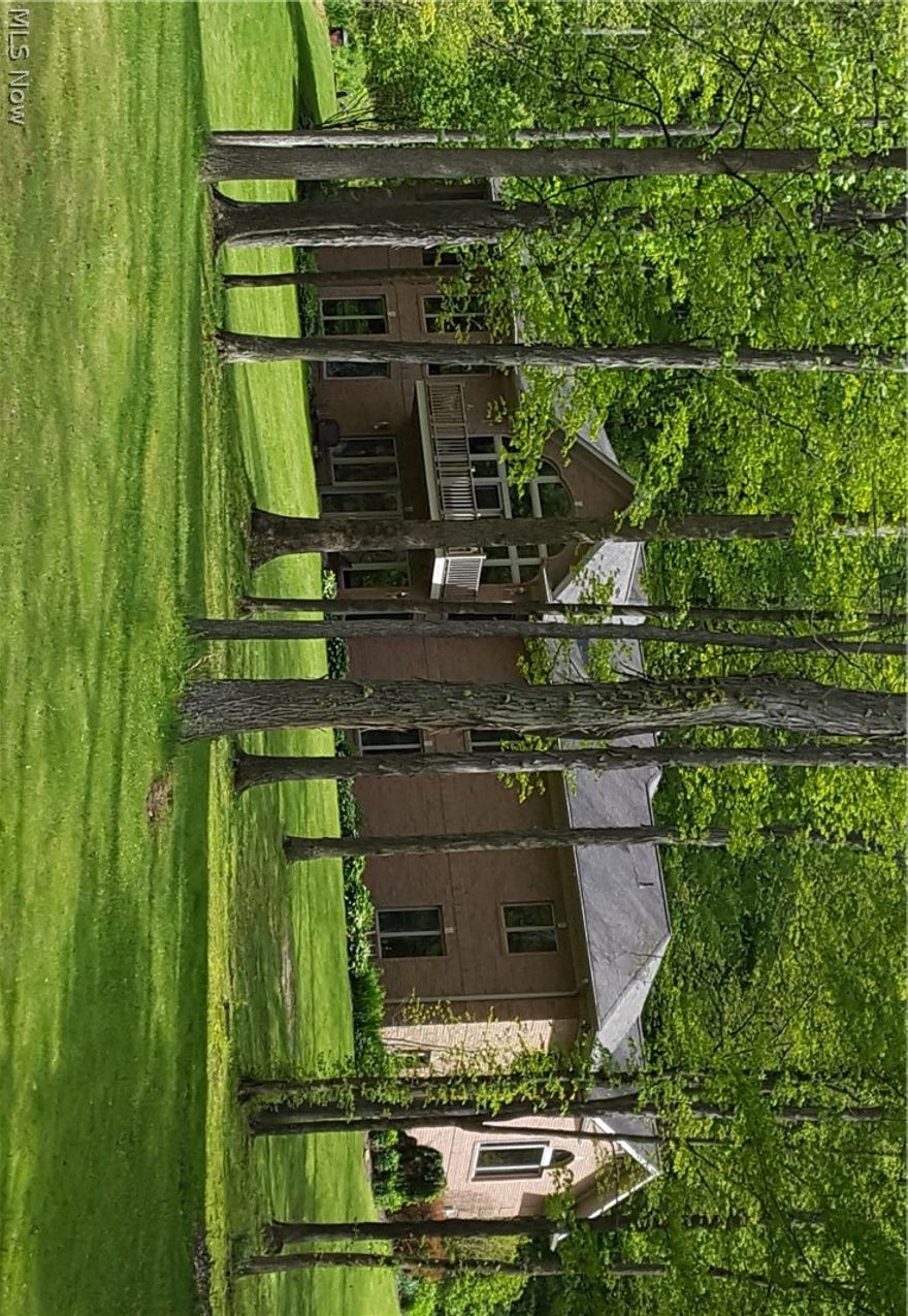 One-owner quality brick Ranch on 40 + or - acres subject to survey. Beautiful setting back in the woods with additional land available. Marketable timber. Built in 2000, this home consists of 2 custom-equipped kitchens, 5 bedrooms and 4 baths. An open, airy great room gives visibility throughout the main floor of the home. A gas stone fireplace with the stone harvested from the property accents the great room along with a wall of windows! 10-foot ceilings and hardwood floors that profess the quality. A full finished walk-out lower level with panoramic views of the countryside and 2 ponds. Abundant wildlife. Minutes to I-77. Unlimited free gas! Truly a rare find!