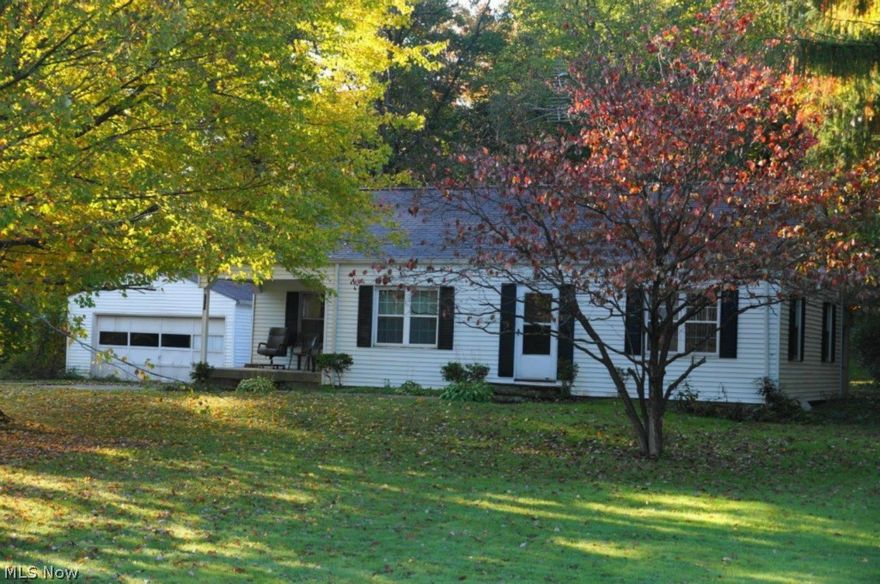 Check out this 3 bedroom 1 bath Ranch on 1 acre in Brimfield.  2 car detached garage and full basement.  Hardwood Floors and fireplace.  3rd bedroom currently being used as a dining room.  Needs love and attention.   Make this your winter/spring project. Gas and Sewer at street.  Selling As Is, Estate.