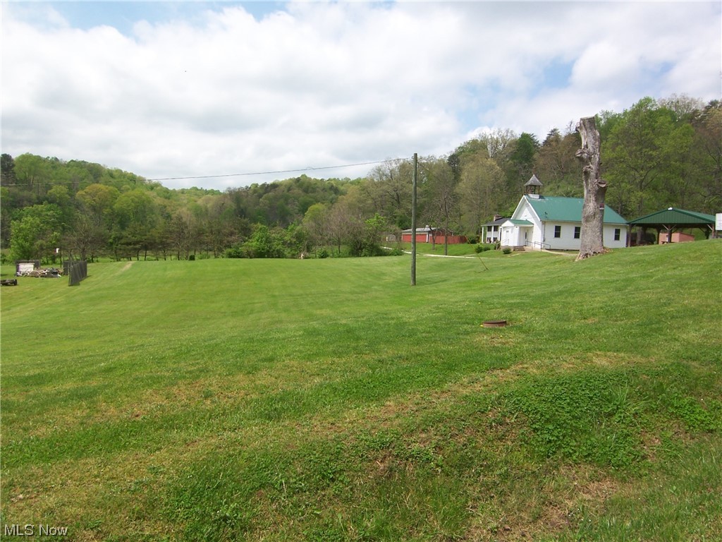 The property has electric, water, and gas access. Buyer on MLS#4457236 at 99 Progress Ridge Road, Walker, WV has first right of refusal on this lot located at 95 Progress Ridge Road, Walker, WV. Nice building lot. Rails to Trails is behind the Post Office.