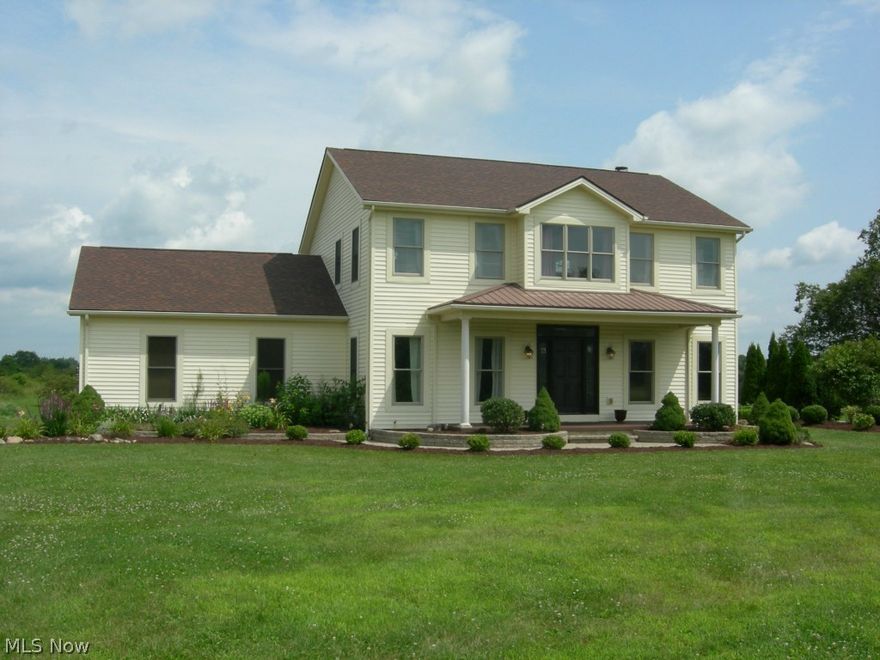 This 4 bedroom,2 1/2 bath colonial,in South Range School district,has breathing room in abundance,inside & out! Situated on 8 lovely acres,with large front porch&huge rear deck to take full advantage of the views.Gorgeous kitchen(open to large family room with brick fireplace)has huge island.Formal living&dining rooms.Finished basement with its' own kitchenette plus loads of storage.Upstairs you'll find a master suite with luxury bathroom plus 3 more bedrooms and one more full bath.2nd floor laundry,for convenience.Updates,since 2010,includes:kitchen&foyer ceramic tile;dishwasher;living room&basement carpet;Kinetico reverse osmosis water system;shed;deck&landscaping re-done.It's the country home with modern conveniences you've been waiting for!