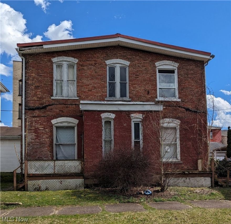 Diamond in rough! 3000+ sq ft duplex in need of repair. 3 large bedrooms, living room, dining room, and eat in kitchen per side. Metal roof! Priced right