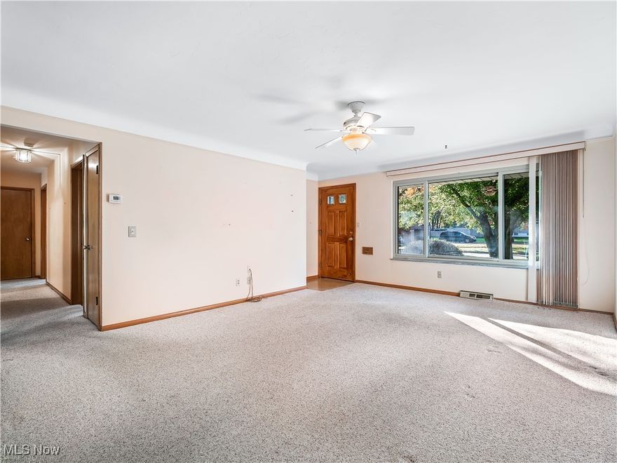 Don't miss this charming, original-owner ranch home in the heart of North Olmsted, just minutes from highways and shopping!  Upon entry, the spacious coved-ceiling living room offers open flow into the dining area, and the beautiful HARDWOOD FLOORS under the carpet are just waiting to be revealed!  The dining area leads into the large kitchen with plenty of countertop and storage space.  The generous-sized bedrooms offer lots of closet space, and easy access to the main bath with renovated oversized shower.  The primary bedroom is tucked away at the rear of the home and features an adjoining half bath with alternate access from the rear hallway.  Pocket doors make this flexible floorplan a dream.  Downstairs the wide open spaces and workshop area provide opportunity for a rec space, storage, and more!  Head out back to enjoy the serenity of the rear yard from the large partially covered patio and deck, just perfect for entertaining.  Other notable updates include blown-in insulation, replacement windows, and maintained Healthy Climate hvac upgrade.