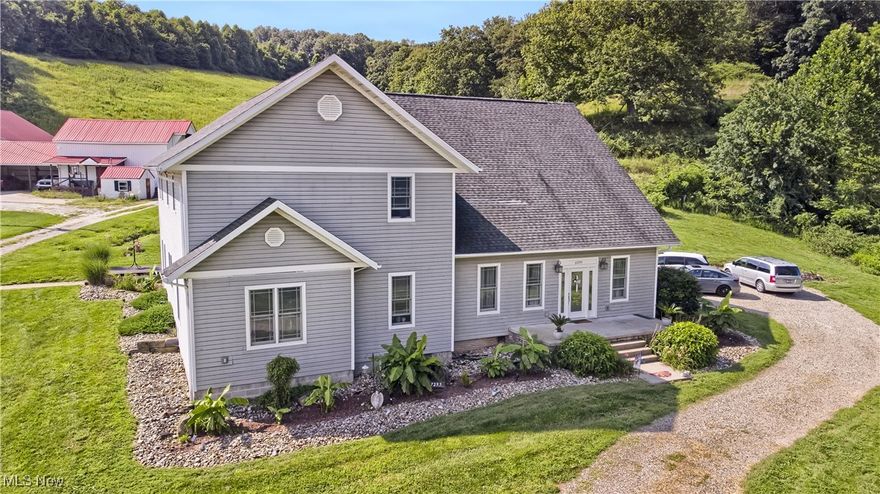 This stunning 4,276 sq. ft. rural retreat sits on nearly an acre and offers 5 bedrooms, 3.5 baths, and a warm, inviting living room with a fireplace. The custom kitchen is a chef’s dream, featuring stainless steel appliances, vaulted ceilings, an island with prep sink, solid surface countertops, farmhouse sink, and rich wood accents. An upper-level loft-style family room overlooks the kitchen, while the spacious primary suite boasts a walk-in closet and a luxurious bath with a soaking tub, separate shower, and dual-sink vanity. Extensively remodeled to feel like a brand-new home, it also includes an unfinished basement for abundant additional space.