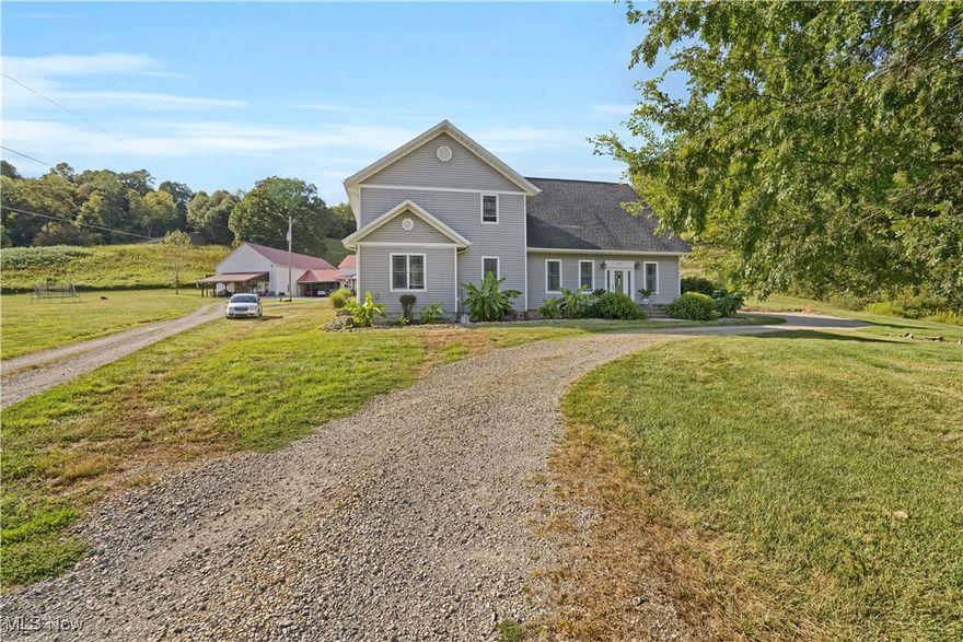 This stunning 4,276 sq. ft. rural retreat sits on nearly an acre and offers 5 bedrooms, 3.5 baths, and a warm, inviting living room with a fireplace. The custom kitchen is a chef’s dream, featuring stainless steel appliances, vaulted ceilings, an island with prep sink, solid surface countertops, farmhouse sink, and rich wood accents. An upper-level loft-style family room overlooks the kitchen, while the spacious primary suite boasts a walk-in closet and a luxurious bath with a soaking tub, separate shower, and dual-sink vanity. Extensively remodeled to feel like a brand-new home, it also includes an unfinished basement for abundant additional space.