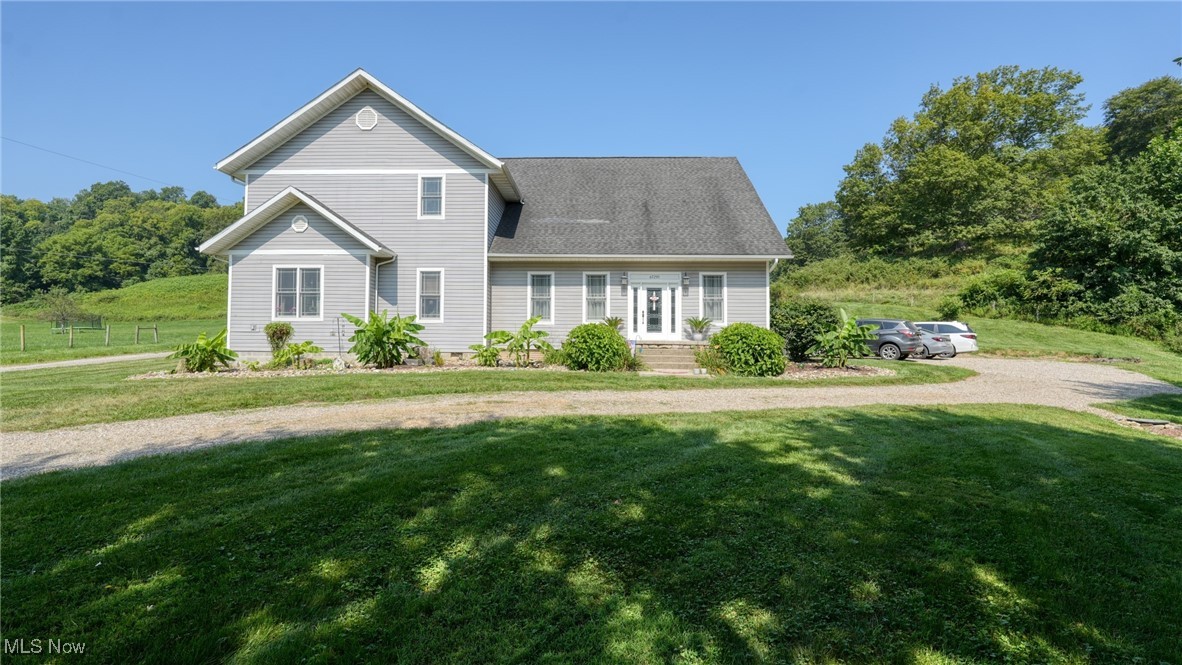 This stunning 4,276 sq. ft. rural retreat sits on nearly an acre and offers 5 bedrooms, 3.5 baths, and a warm, inviting living room with a fireplace. The custom kitchen is a chef’s dream, featuring stainless steel appliances, vaulted ceilings, an island with prep sink, solid surface countertops, farmhouse sink, and rich wood accents. An upper-level loft-style family room overlooks the kitchen, while the spacious primary suite boasts a walk-in closet and a luxurious bath with a soaking tub, separate shower, and dual-sink vanity. Extensively remodeled to feel like a brand-new home, it also includes an unfinished basement for abundant additional space.