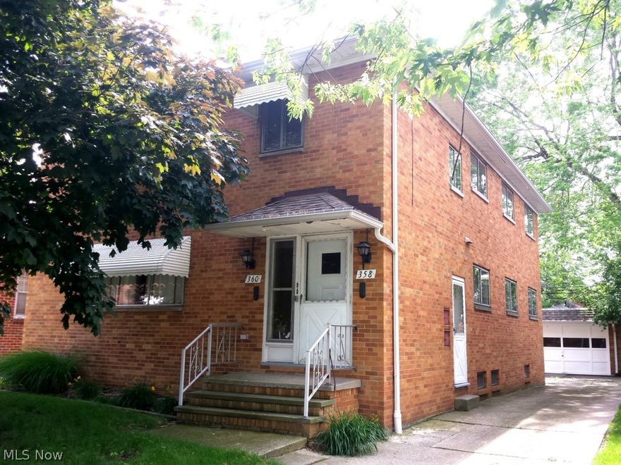 Neutral and clean.  Move-in ready, brick, 2-family.  Both units have 3 bedrooms and 1 bath [1232 Sq.Ft.]; beautiful hardwood floors;  separate utilities; full basement with half bath, washer & dryer; 1st unit has newer A/C, some appliances; house roof approx. 7 yrs; 2-car garage roof 2 yrs; wonderful location - close to I-90, university circle and downtown; each unit has a covered rear porch; property will be violation free.