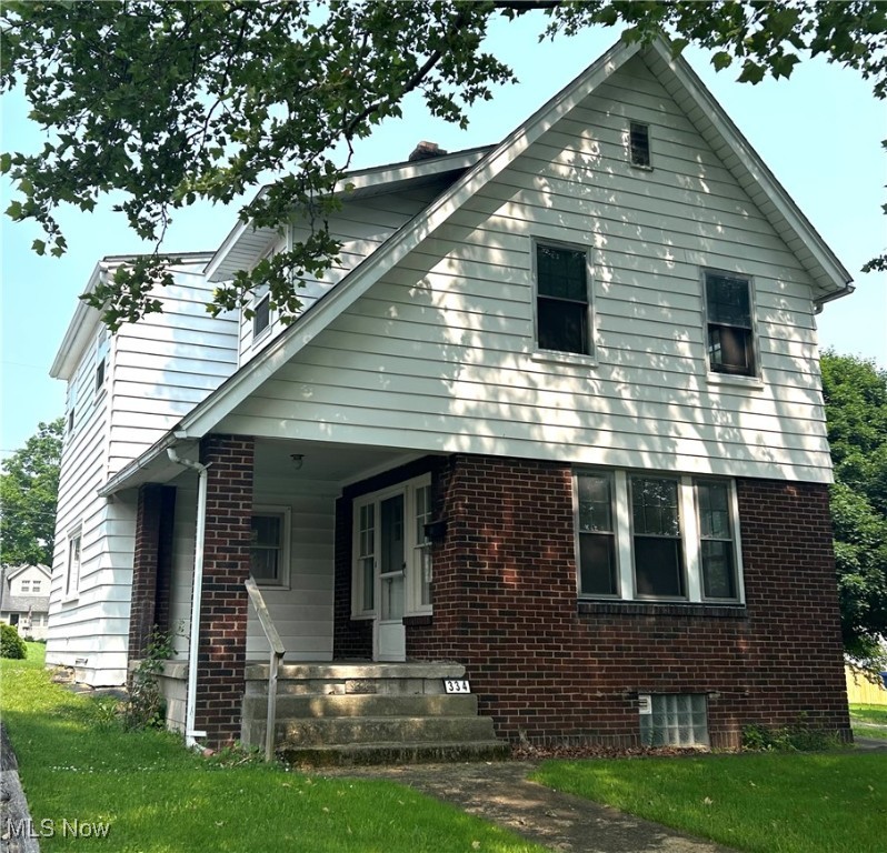 This Brick-Vinyl sided McDonald Village Home is Ready for a New Owner! and it's located NEAR THE PARK...Seller Down Payment Assistance Available... Large Covered Front Porch- a Welcoming Entry Area! Front door access opens to the Living room -Bright and Cheery with 7 sets of French topped windows- A Charming & Solid Home. There is a large Great Room and it is dual purposed- Dining Area open to Family area...front portion has space for the dining table and chairs...there's a Kitchen passthrough- useful for serving conveniences...This room features Floor to ceiling Rustic Brick Wall with cozy corner -You could white wash it if you Like! Kitchen has Light Formica Countertops and is equipped with a Gas stove and Black dishwasher, also a Door to the back yard- NEW FURNACE, AND NEW ROOF- The Big ticket items are NEW!! Master bedroom is nice sized and has a walk-in closet. Bedroom 2 and 3 are good sized -auditor states - 3 bedrooms- it will work out nicely as a media room or office! Updated Bathroom with dark Vanity and Mirror. Interior freshly painted! Laundry area with utility sink, Large storage or work shop room and Glass block windows in Basement! Detached Garage w/ covered carport - Wooden Back porch and a deep back yard!! Call today to schedule an appointment - You'll be one step closer to Your Home Sweet Home!