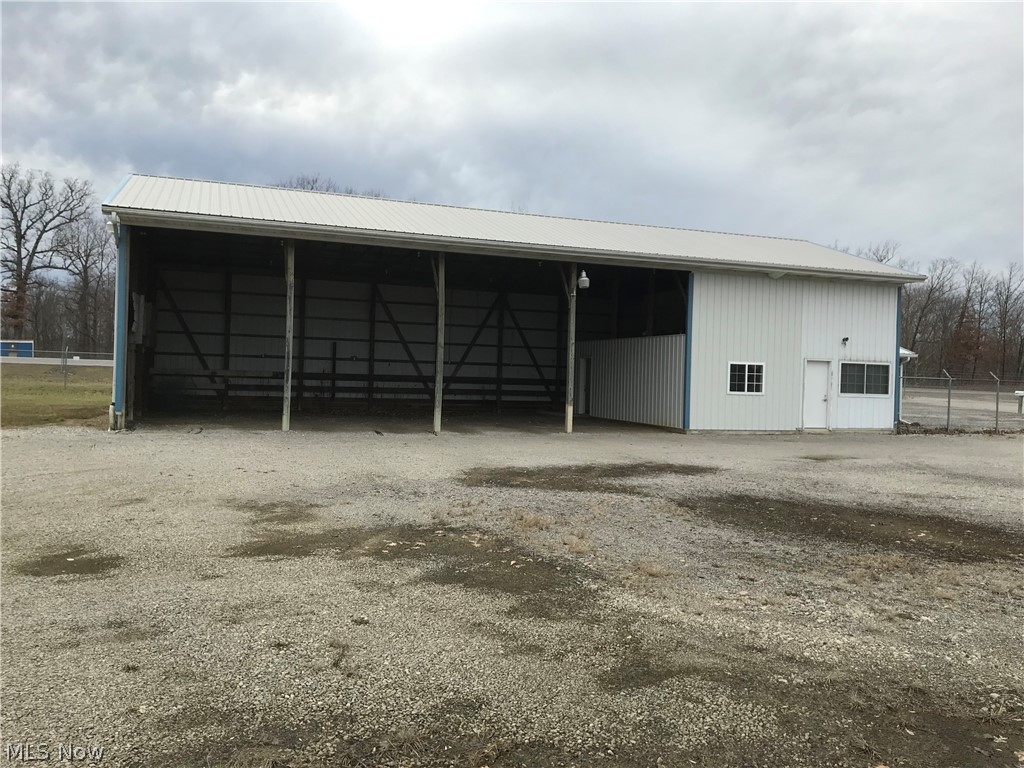 3.48 acres located on SR 250 with access from St Rt 162 also. Great visibility with alot of truck traffic. 12' x 32' office building with an attached 32' x 60' lean to (used to story delivery trucks). Septic System & water well added in 2001. Zoned Industrial/Commercial