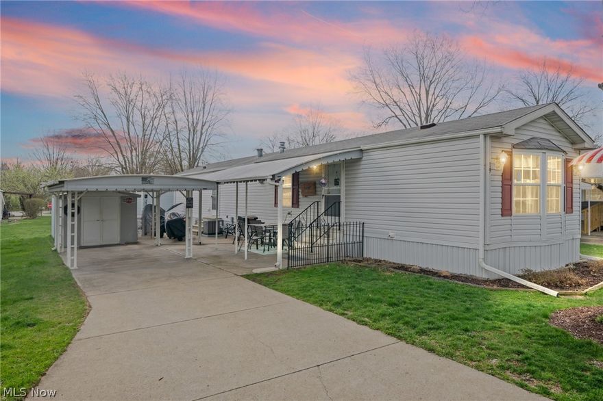 Located on a desirable, wide street within the community, this charming home is surrounded by green space, mature trees, and sidewalks for easy strolls. Inside, you’ll find an inviting open floor plan featuring two bedrooms and a spacious full bath complete with a soaking tub and separate shower. All appliances are included for added convenience.

Updates provide peace of mind, including a furnace, central air, under-body insulation, and refrigerator (2021), along with a stove and hot water tank (2017). Exterior highlights include a carport, large covered porch with awning, and two storage sheds.

Situated in a gated 55+ community, residents enjoy access to walking paths, a community party room, dog park, and picnic areas with grills—perfect for relaxed, low-maintenance living. Inspection done less than a year ago. Available upon request.